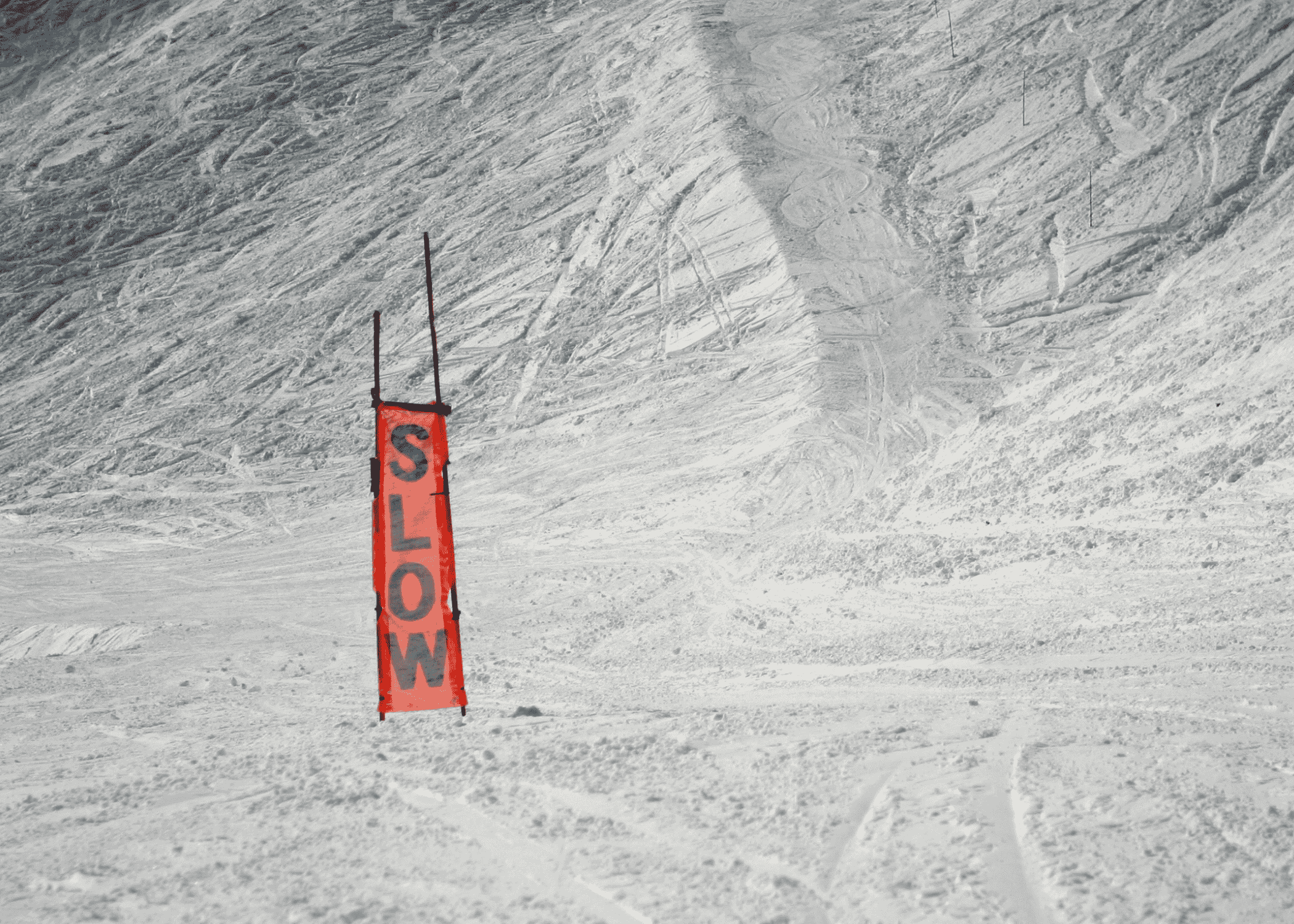 slow sign on a ski hill
