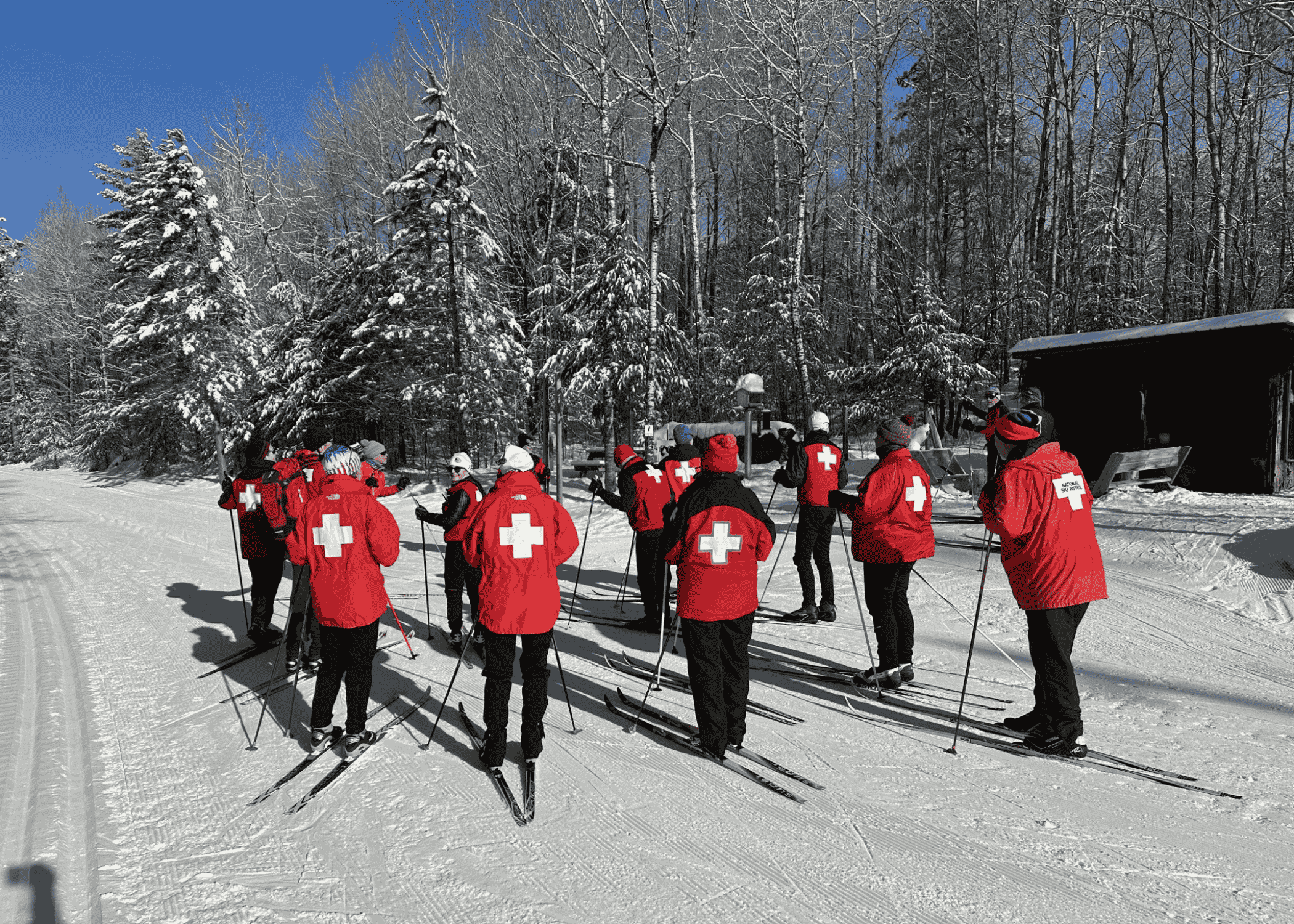 a group of nordic skiers going out on the trail